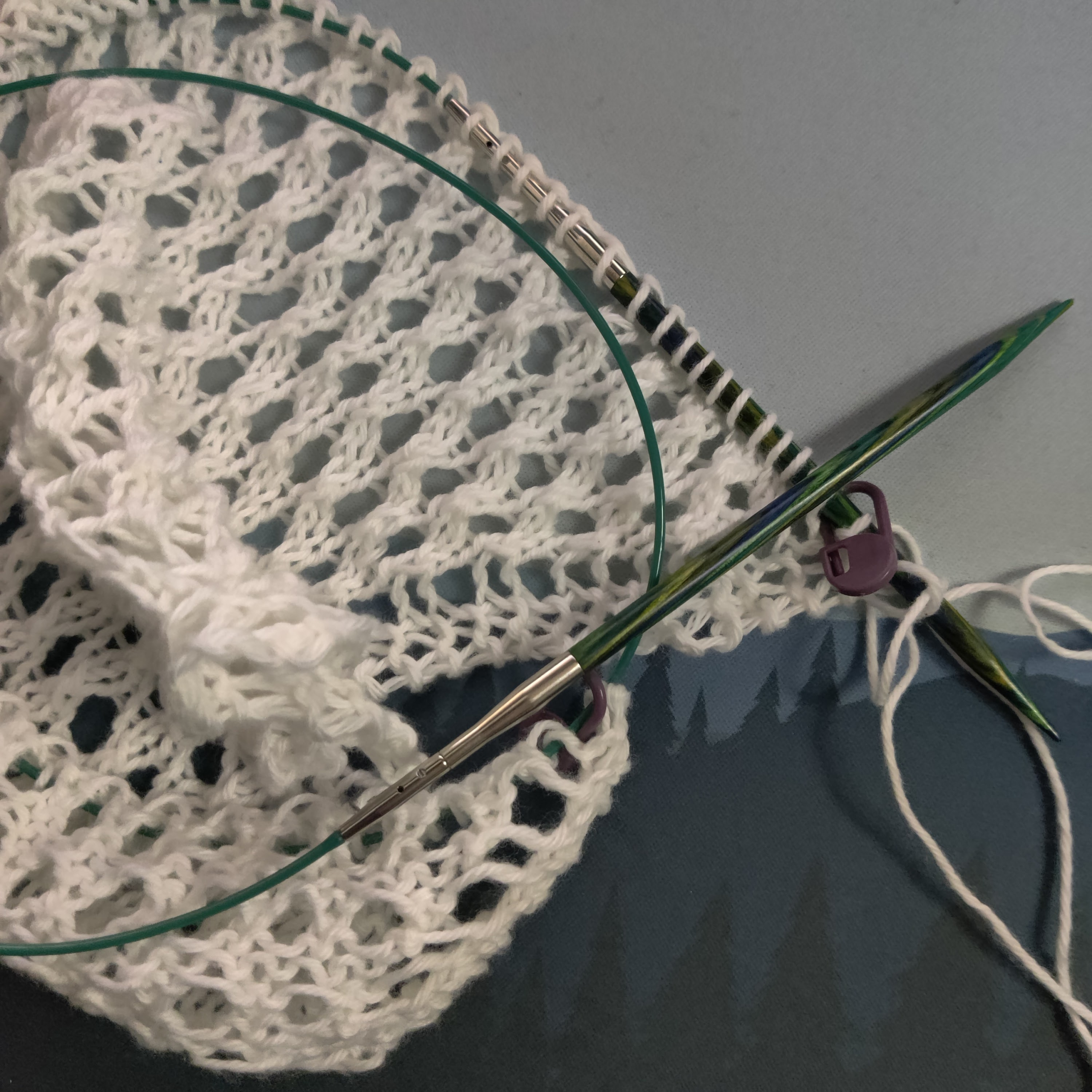 Knitting a wedding shawl for my sister's upcoming wedding! I'm using the pattern Easy as Pie by Marisa Hernandez. Image shows a project using thin white yarn already in progress on circular needles.